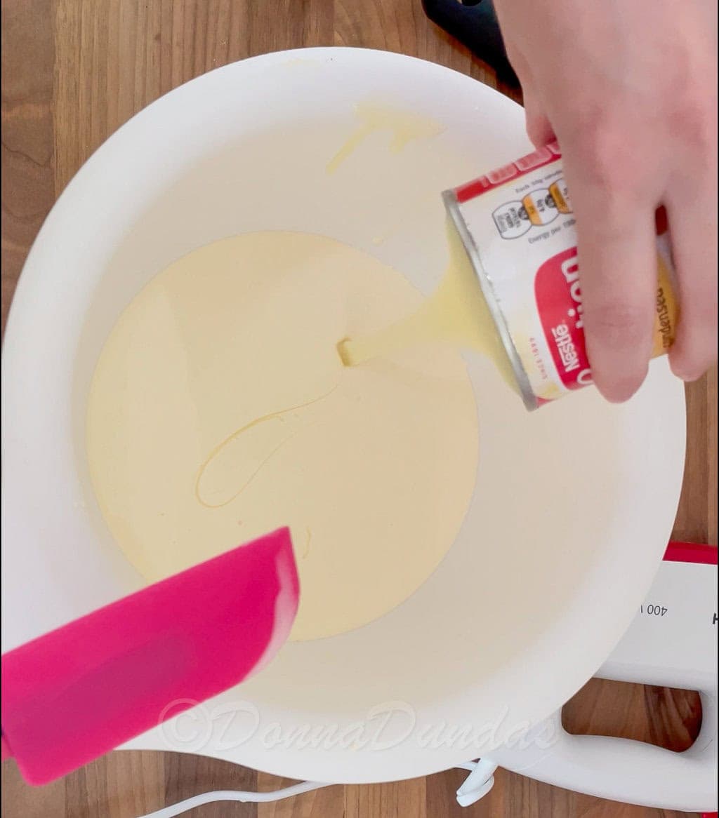 cream and condensed milk in mixing bowl.