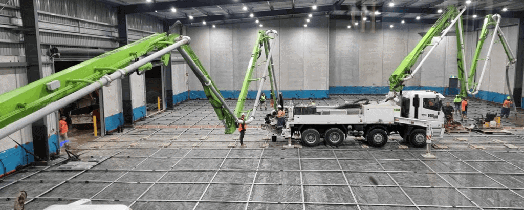 Pumping concrete over extended lengths warehouse internal floor