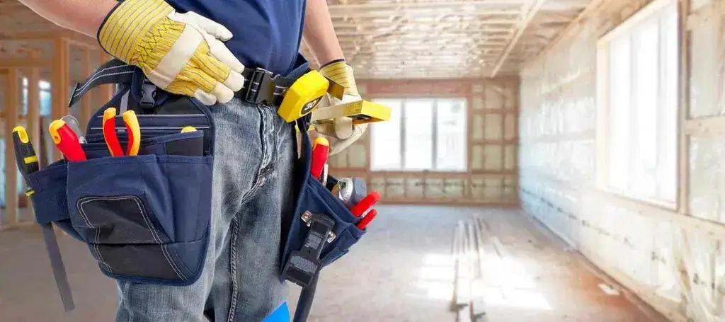 Handyman helping a homeowner safely