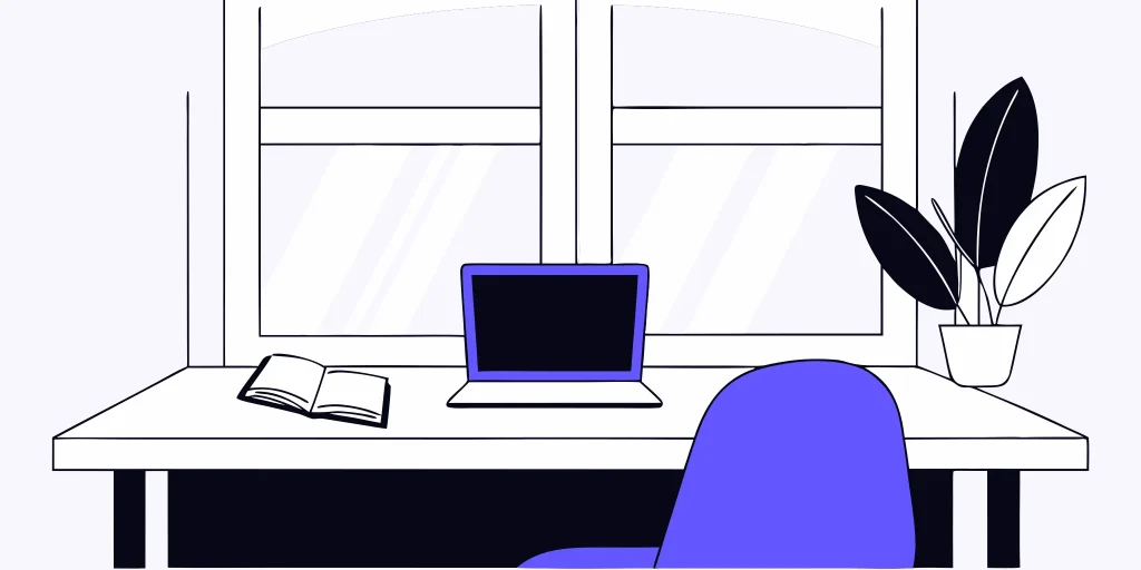 A desk with a laptop and an open guide on what counts as sexual harassment.