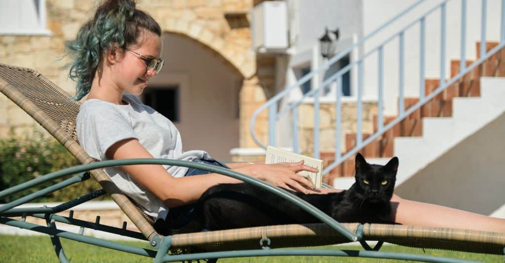 A girl lying on a camping lounger