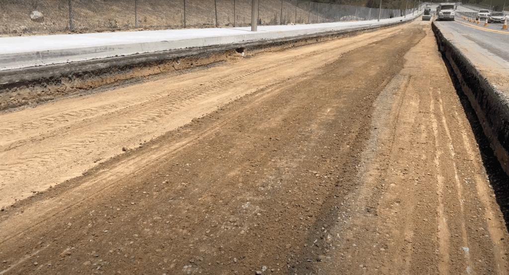 Clean dirt excavation cut made with a Wirtgen milling machine showing depth and grade after full-depth removal.