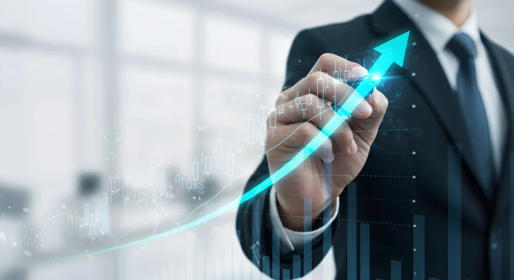 Businessman sketching upward arrow on graph, symbolizing growth, success, and improved financial performance metrics