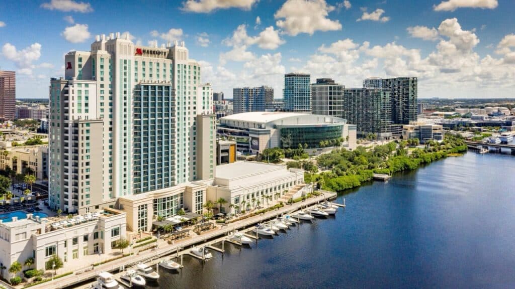 Luxury hotel overlooking Tampa Bay with marina and city skyline in Florida.