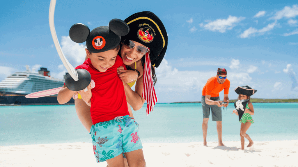 Family enjoying a Disney-themed beach vacation with cruise ship in the background.