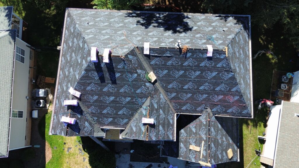 Drone view of synthetic underlayment covering the whole roof during an Owens Corning Duration Onyx Black roof replacement in Ballantyne, Charlotte NC