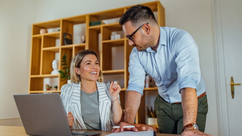 A Realtor and Client Happily Discussing