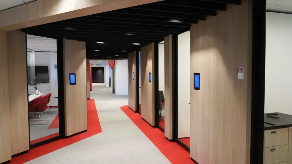 Office corridor with secure entry points and IPROTECT access control entry panels