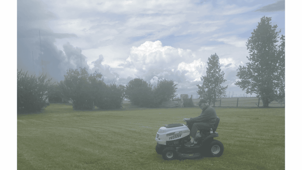 Dad and his wheels cutting grass in my backyard Dad and his wheels cutting grass in my backyard