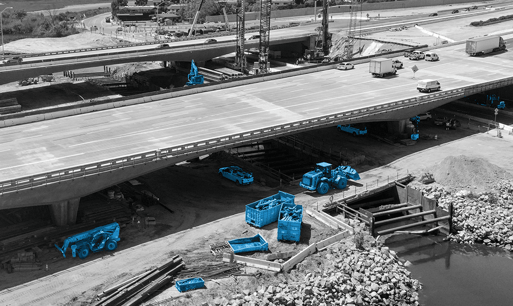 Construction leader looks at data from heavy equipment tracker