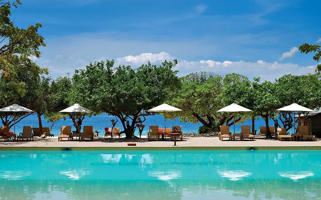 This is a picture of the poolside at a luxury resort in Palawan. You can see the ocean in the background!