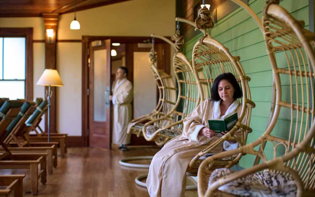 Woman Reading in the Solarium at Our Hudson Valley Spa Resort