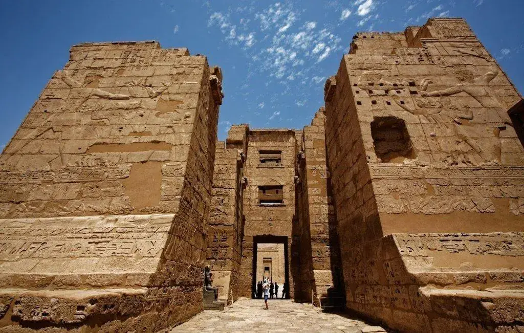 Ancient Egyptian relief of Ramesses III and deities at Medinet Habu