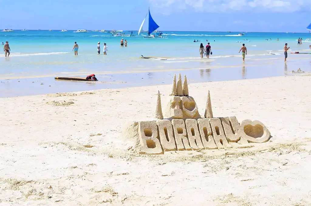 A picture of White Beach with a sand castle saying I [heart]  Boracay!