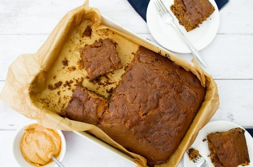 Sticky Toffee Traybake in a pan with caramel sauce