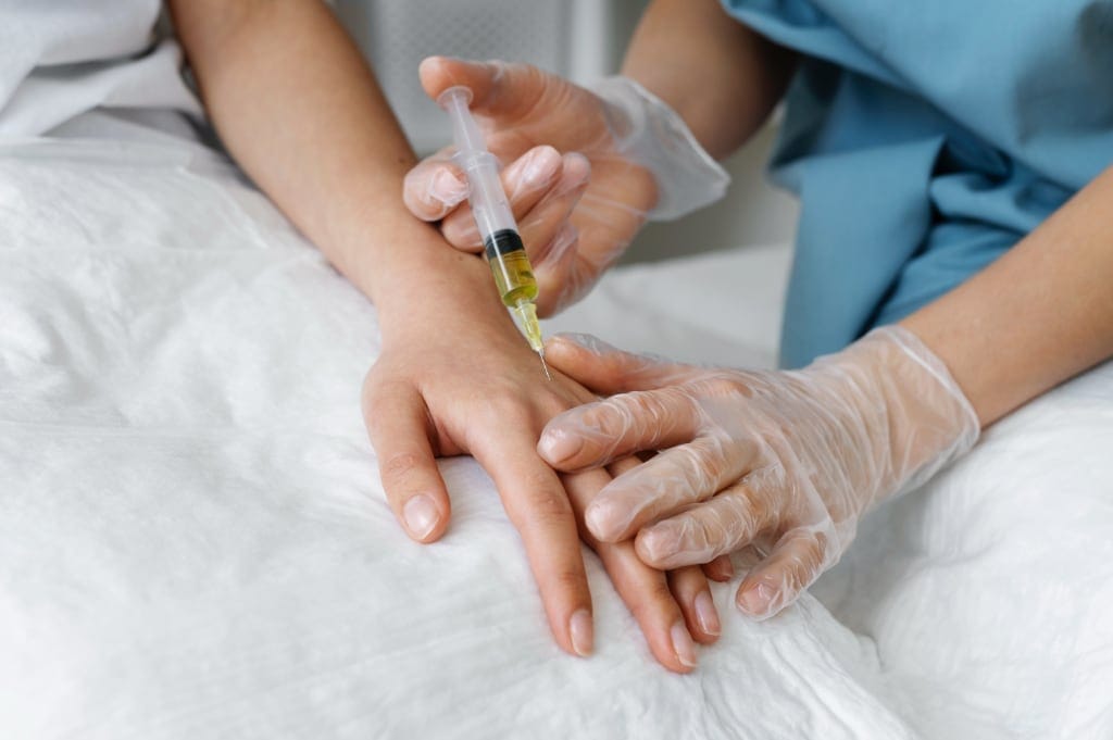 Our Services 5 high-angle-healthcare-professional-injecting-arm