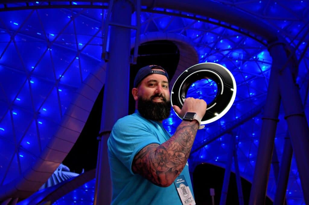 Vibrant night scene at Epcot with illuminated architecture and blue lighting, ideal for Disney vacation travel.