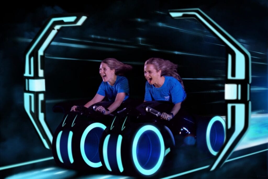 Two girls enjoying a high-tech virtual reality ride at Disney World.