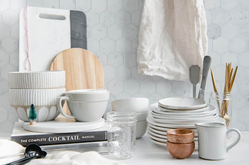 Wide angle of food photography props like ceramic plates and bowls, pinch bowls, cutting boards, etc.