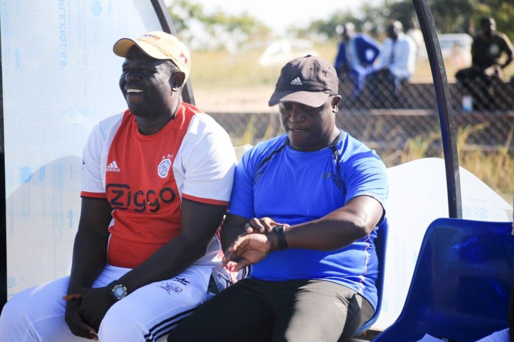 Lovemore Dzoro [in red] with Prince Tafirenyika during a match