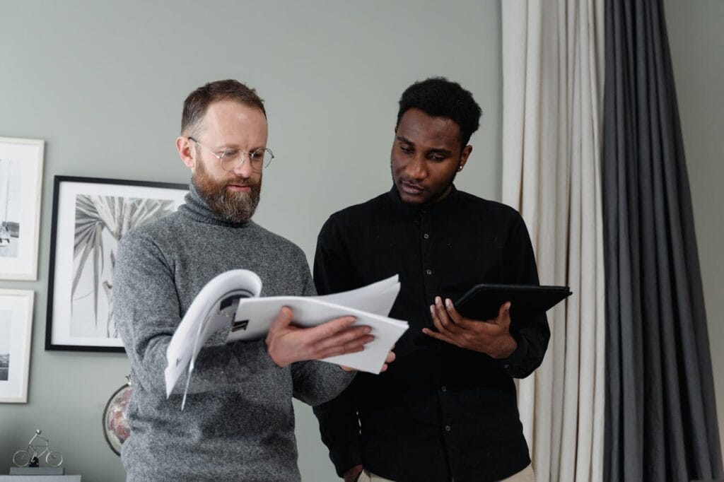 Colleagues Discussing Paperwork