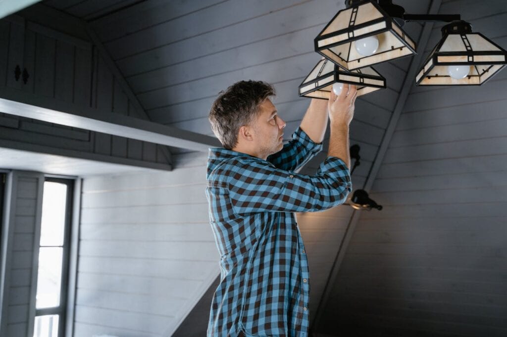 A Man Changing a Light Bulb