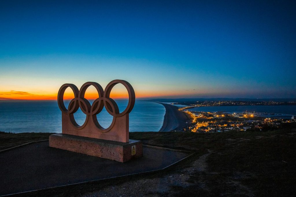 The Olympic rings with a panoramic background
