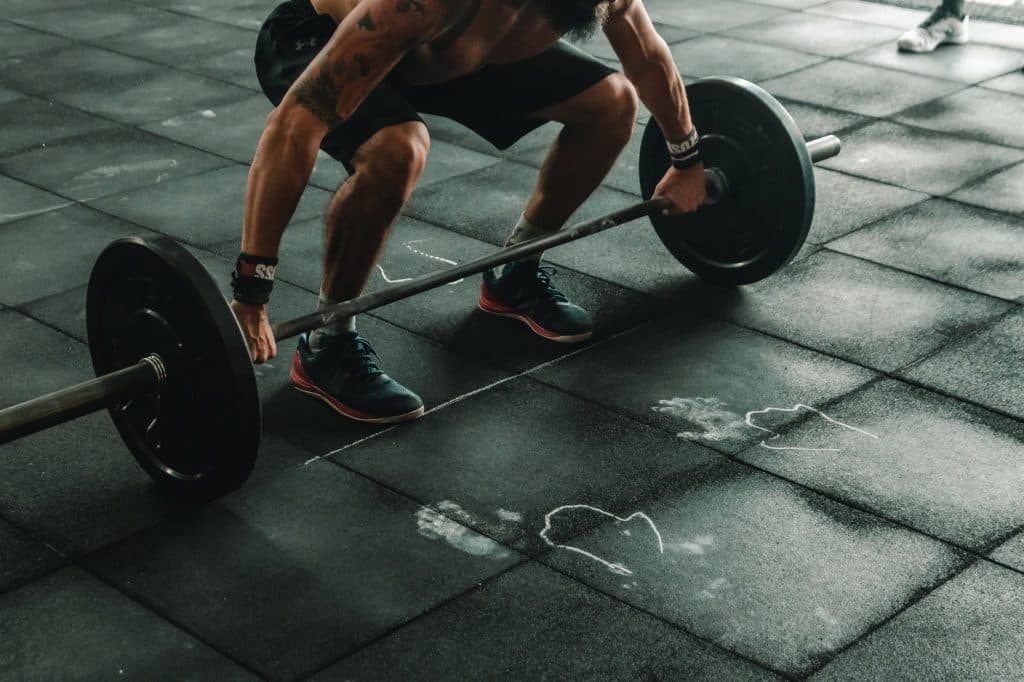 A man about to lift a barbell
