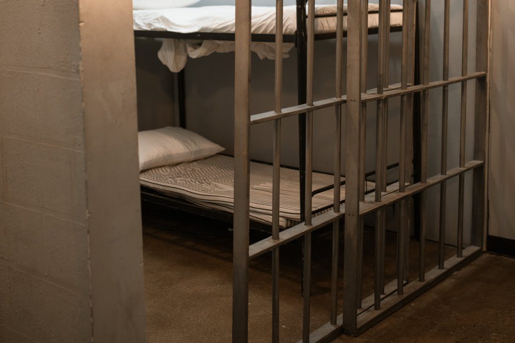 A prison cell with the door half open