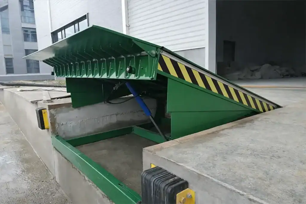 Side profile of a raised hydraulic dock leveler highlighting the double 5-degree arch lip, designed to ensure smooth forklift transitions and eliminate severe jolts during loading.