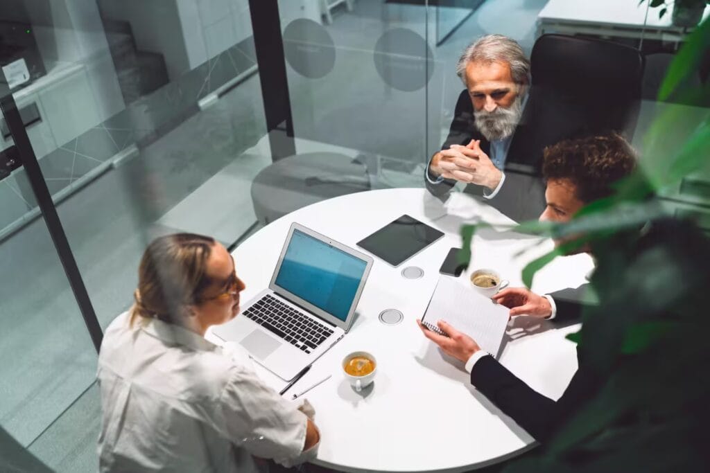 ARCSA CAPITAL institutional investors in a private roundtable discussion analyzing real estate portfolios and long-term capital strategies.
