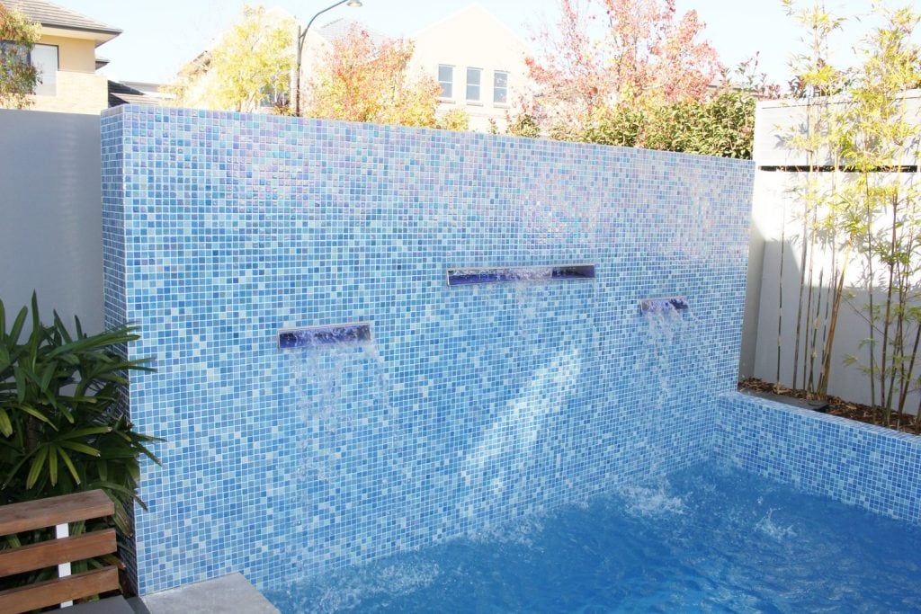 Glass mosiac pool tiles in a residential house project