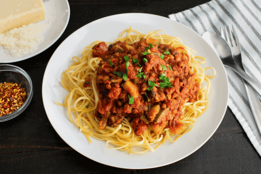 A lentil bolognese pasta sauce over spaghetti.