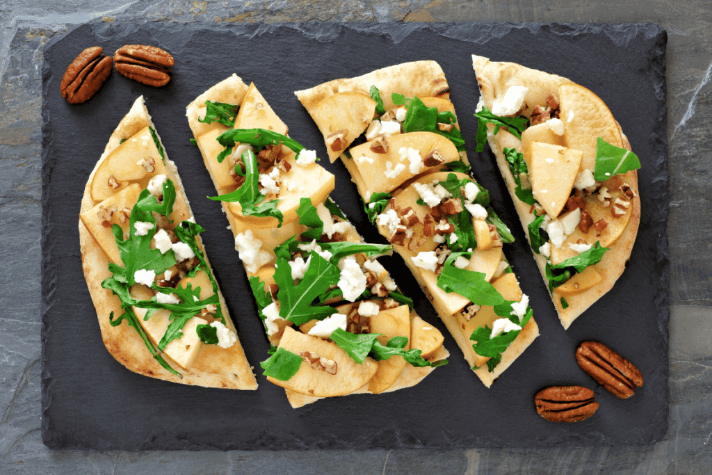 An apple, pecan, and arugula flatbread.