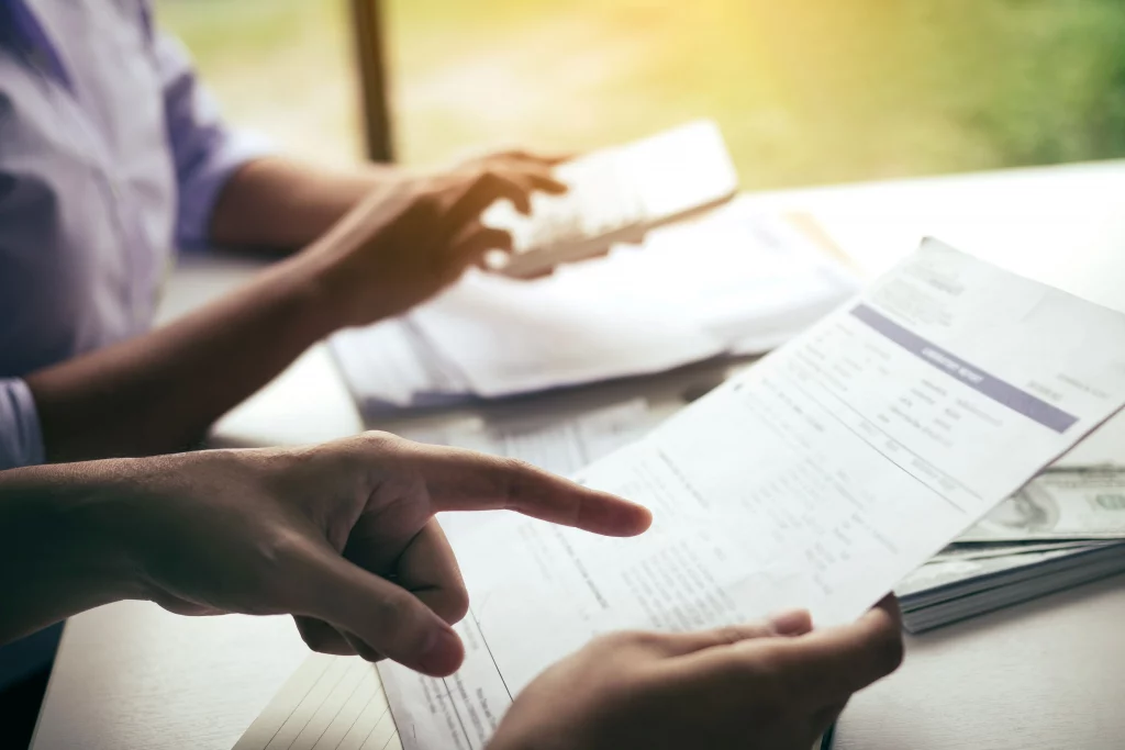 Architect reviewing building plans and providing pre-planning advice for construction projects