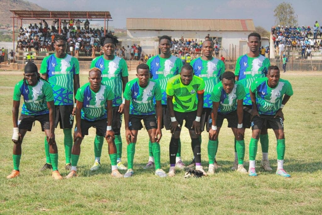 Blanket Mine FC players pose for a photo