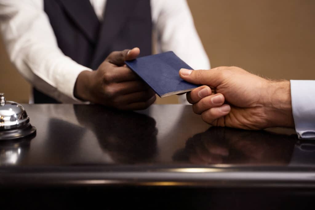 German embassy Nigeria appointment: a Nigerian student holding a passport for the 2026 VFS Lekki visa process