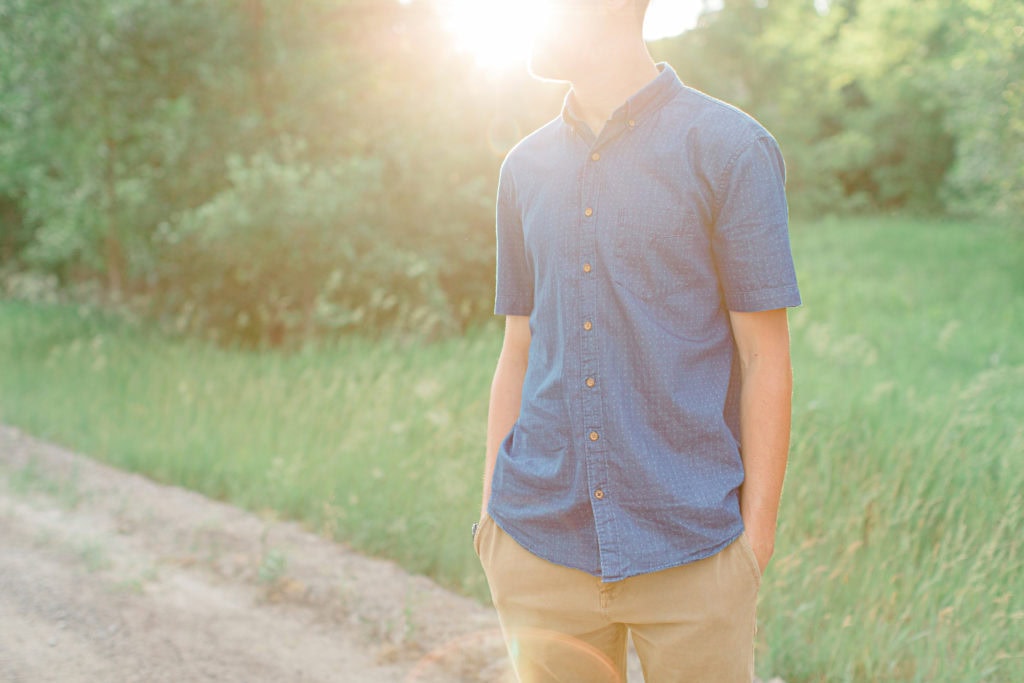 Groom to Be - posing during Engagement Session Sunset - Natural Posing for Photo Session - Couples Photo Session Fun - Fun on the Farm - Farm Engagement Session - Blue and Brown Engagement Session Inspiration - Natural Engagement Session Posing - Ideas for what to wear for Engagement Photography, Modern Engagement Session Inspiration Wardrobe Ideas. Unsure of what to wear for your engagement photos, we've got you! Romantic brown with black leggings for Summer Engagement in Almonte. Grey Loft Studio is Ottawa's Wedding and Engagement Photographer for Real couples, showcasing photos that are modern, bright, and fun.