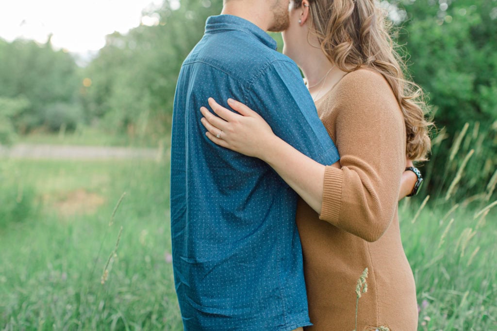 Poses during Engagement Session Sunset - Natural Posing for Photo Session - Couples Photo Session Fun - Fun on the Farm - Farm Engagement Session - Blue and Brown Engagement Session Inspiration - Natural Engagement Session Posing - Ideas for what to wear for Engagement Photography, Modern Engagement Session Inspiration Wardrobe Ideas. Unsure of what to wear for your engagement photos, we've got you! Romantic brown with black leggings for Summer Engagement in Almonte. Grey Loft Studio is Ottawa's Wedding and Engagement Photographer for Real couples, showcasing photos that are modern, bright, and fun.