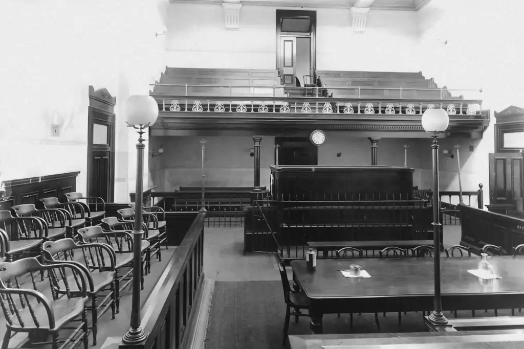 Empty historic courtroom with bench, dock and public gallery — Hague Access to Justice Convention in force for Ukraine
