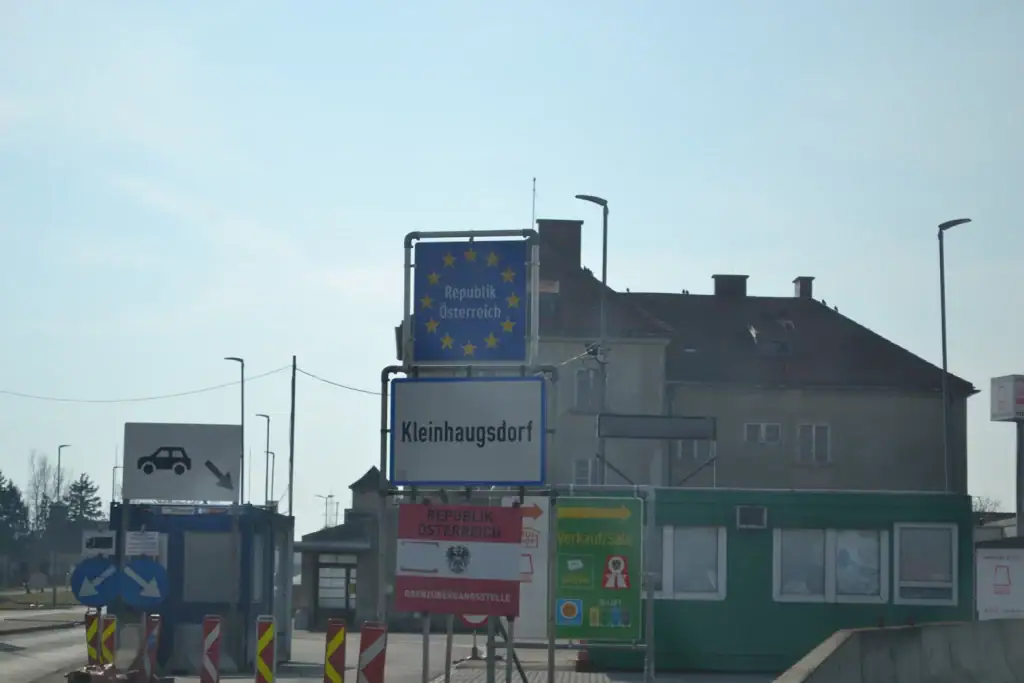 A border crossing with a European Union road sign