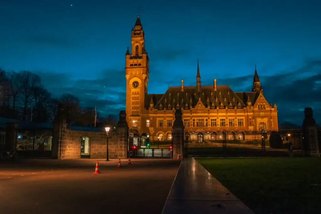 The Peace Palace in The Hague at dusk — seat of the Hague Conference on Private International Law