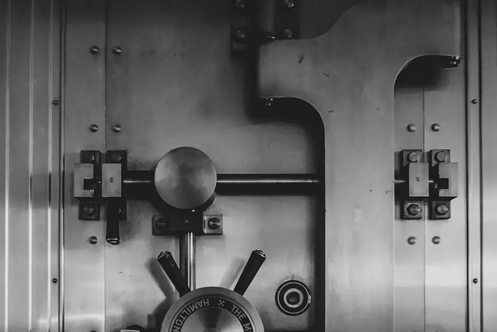 Steel vault door with bolts and locking bars — security for costs must be placed on the court deposit account before the claim can proceed