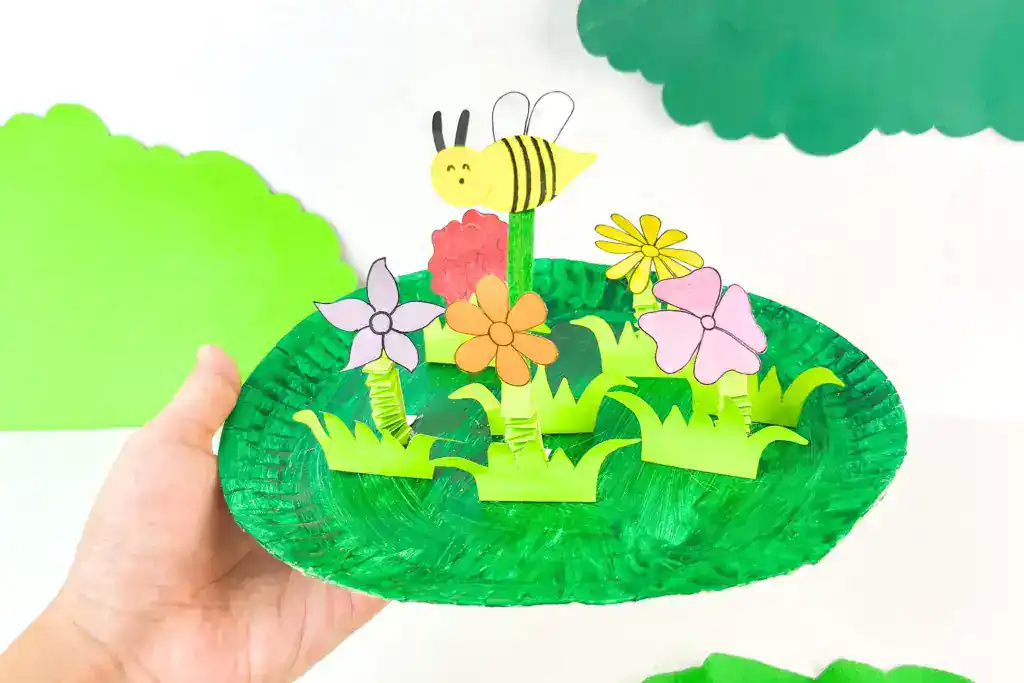 paper plate flower garden with flowers and bee.