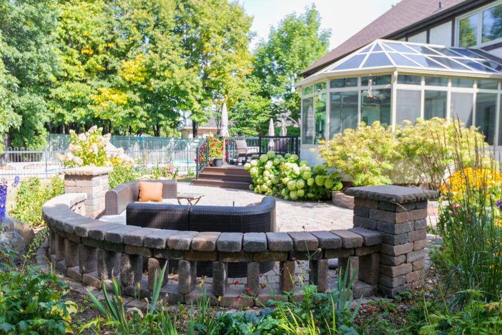 Backyard firepit and stone patio landscape design