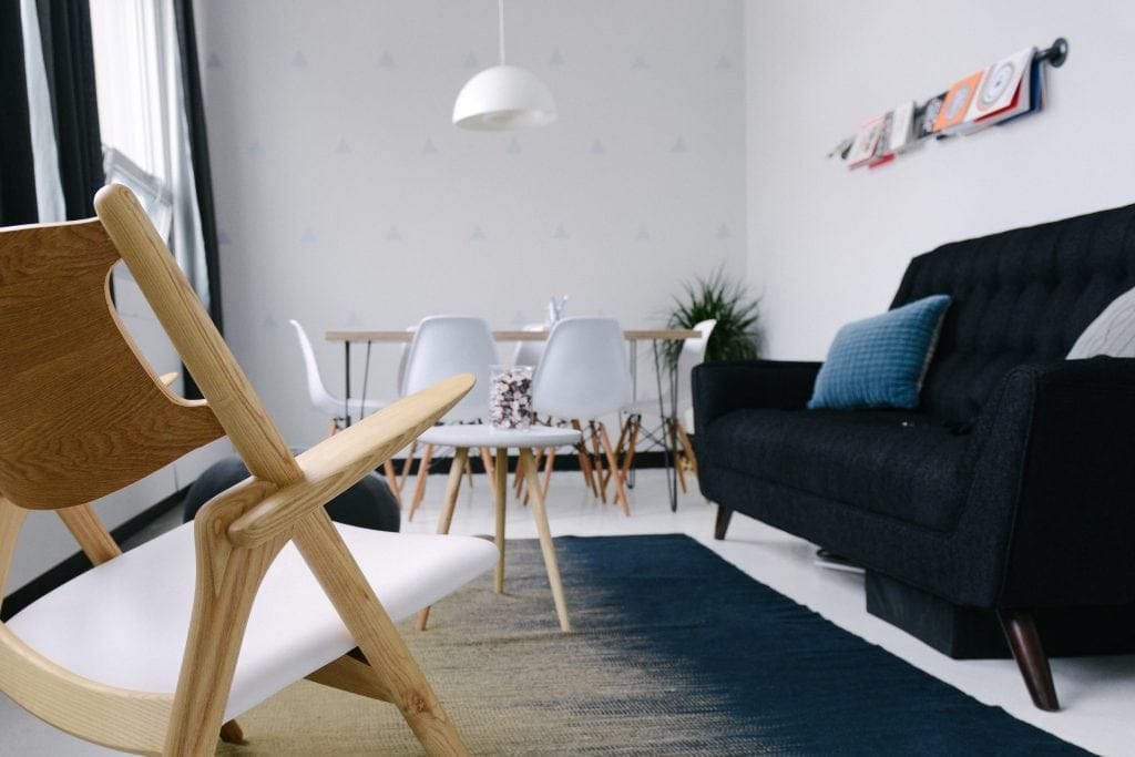 Office desk and chairs within a white room