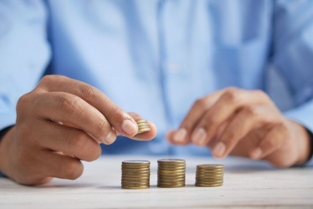 A man stacking coins.