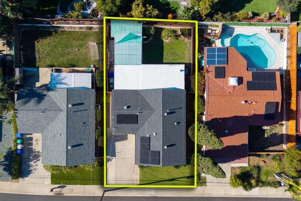 Top-down aerial property line view of 2170 Montclair St in North Park, highlighted in yellow, showing the roof and backyard layout.