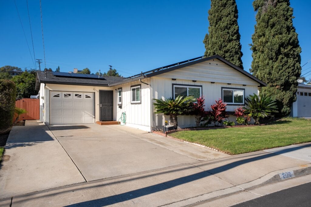 Ground-level perspective of the driveway and front entrance of 2170 Montclair St in North Park.