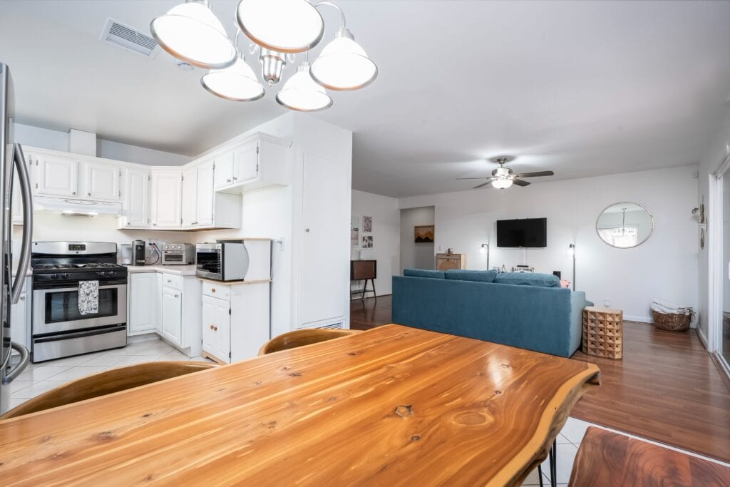 Kitchen and dining area at 2170 Montclair St in North Park showing updated flooring and open layout flow to the living room.